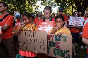 Mass Shooting survivors and families are devastated by the tremendous shooting incident. They gathered to send messages to the government using placards. (Photo: The New Republic)